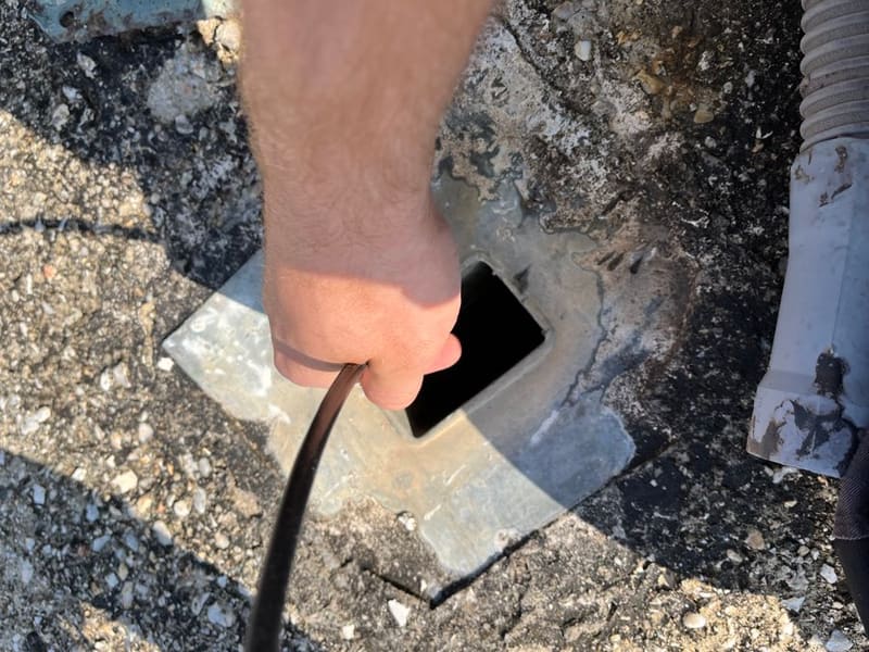 Feeding equipment into the manhole